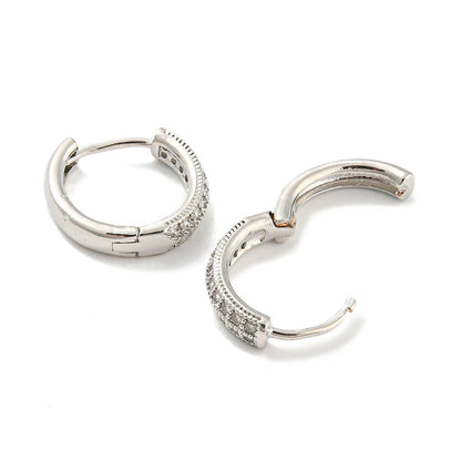 Pair of silver hoop earrings with small diamonds on a white background