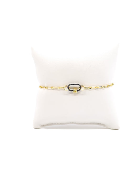 Madilyn chain link bracelet w. Micro Bella oval twist carabiner on white cushion.