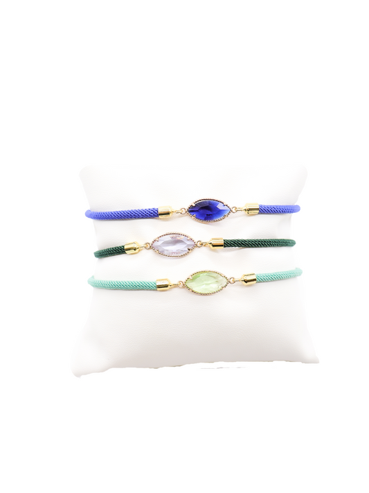 Front of three Cord Bracelet with Large Faceted Glass Connectors in Navy, Forest, and Teal