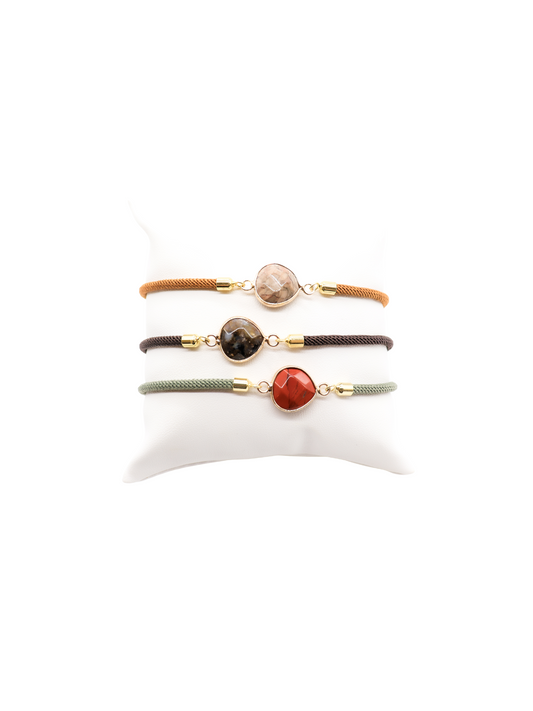 Front of three Cord Bracelets with Teardrop Stone Connector in brown, grey, and light green