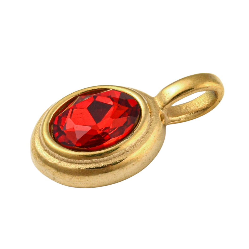 Side of the Gold Oval Framed Red Glass Stone Charm on a white background