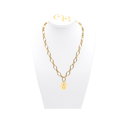 Phi Mu gold large link evermore necklace with large oval charm with vertical greek letters on white necklace bust front