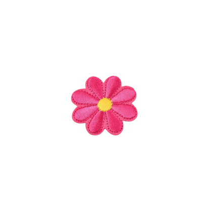 Pink flower-shaped object with a yellow center on a white background