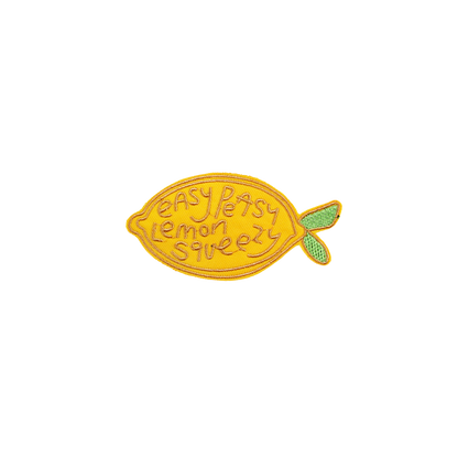 Yellow lemon-shaped patch with 'easy peasy lemon squeezy' text on a white background