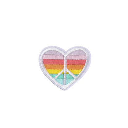 Heart-shaped patch with peace symbol and rainbow colors on a white background