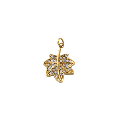 Gold leaf-shaped pendant with embedded crystals on a white background