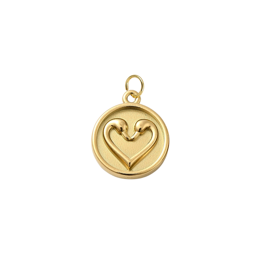 Gold pendant with a heart design on a white background