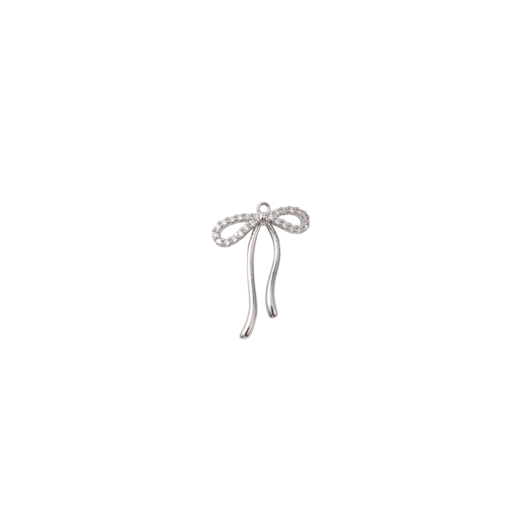 Silver bow-shaped earring on a white background