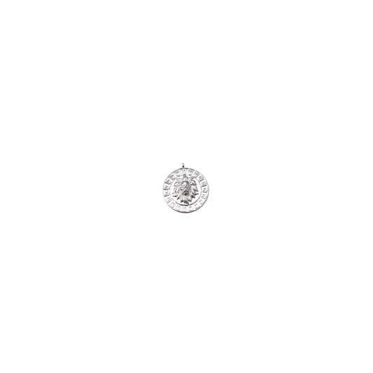 Silver pendant with a circular design on a white background