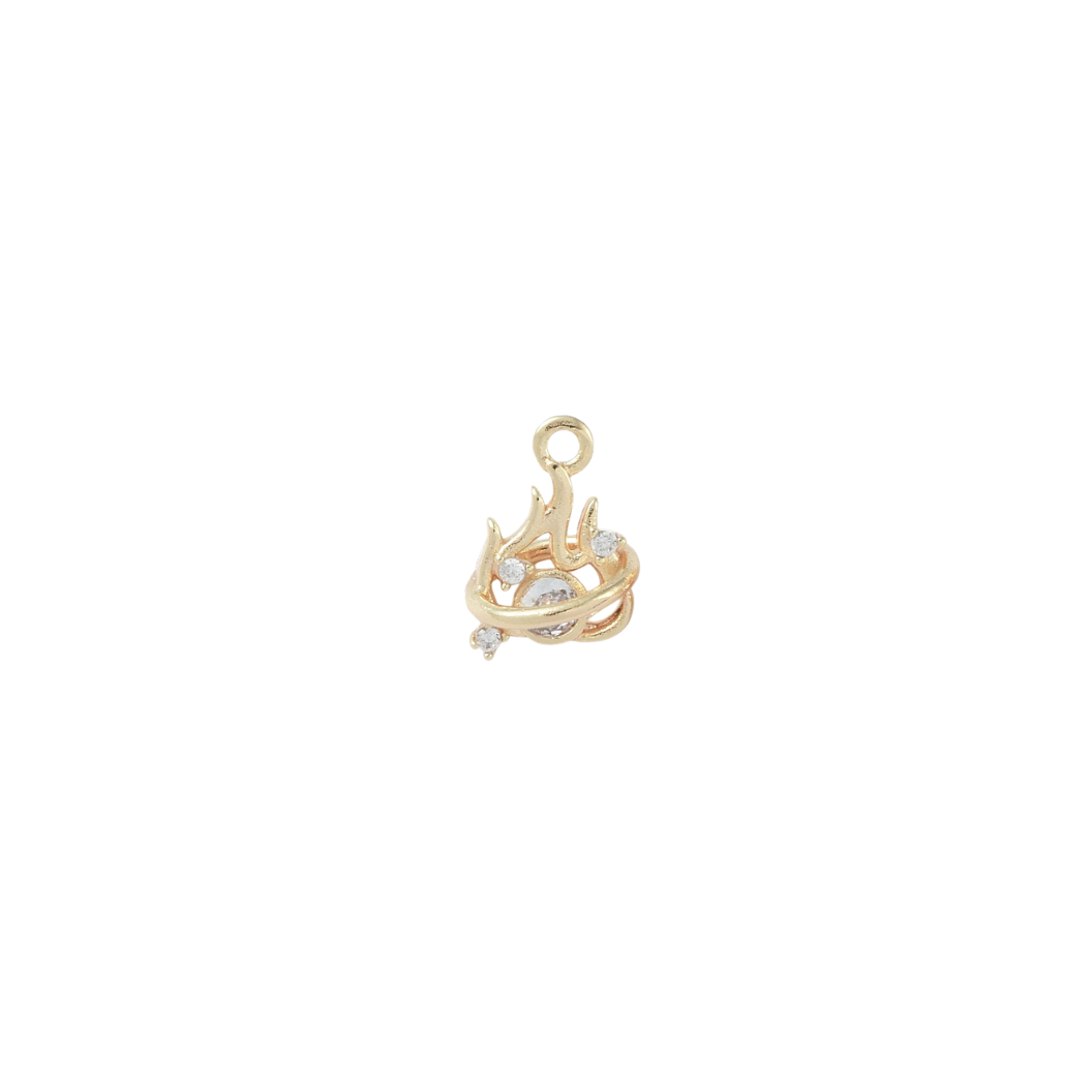 Gold pendant with intricate design on a white background