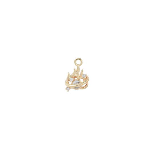 Gold pendant with intricate design on a white background