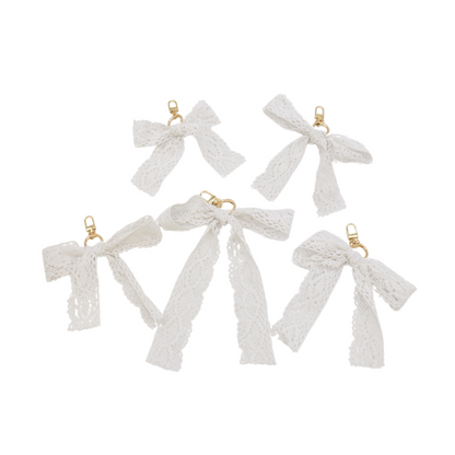 Front of five Lace Bow Purse Charm | White