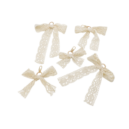 Front of five Lace Bow Purse Charm | Ivory