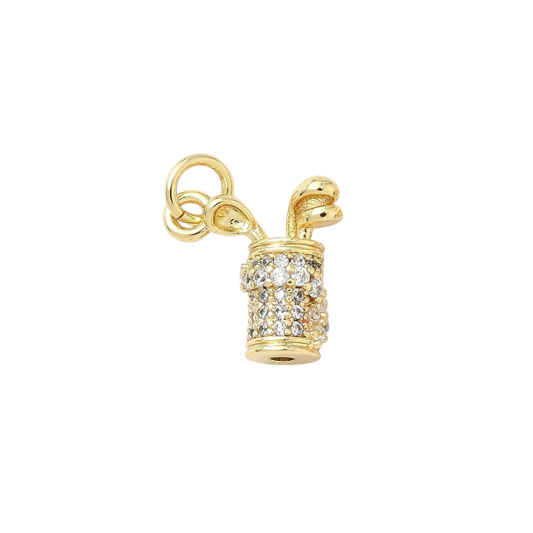 Gold charm with a cross design on a white background