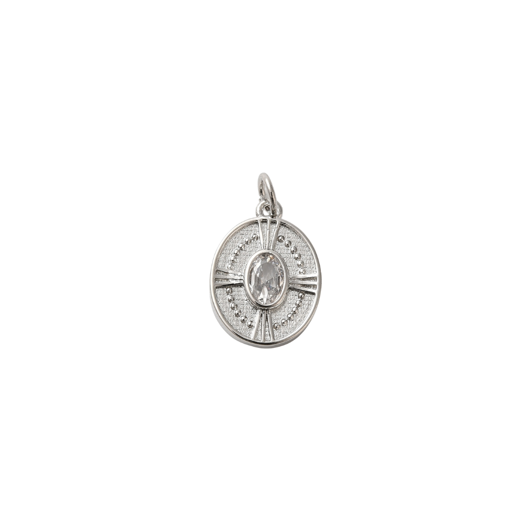 Silver pendant with a central gemstone on a white background