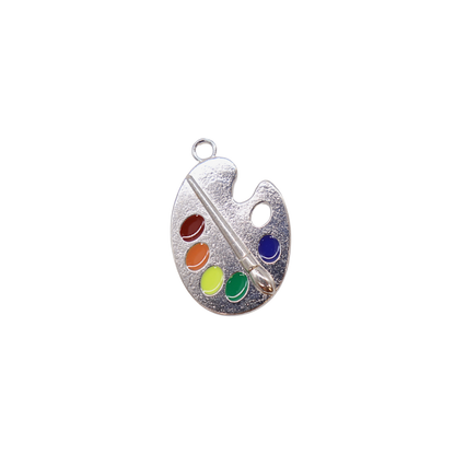 Silver paint palette charm with colorful dots and a paintbrush on a white background