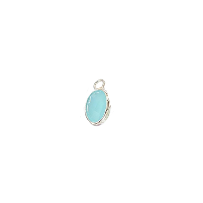 Turquoise pendant with silver setting on a white background