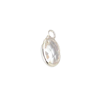 Silver pendant with a clear gemstone on a white background