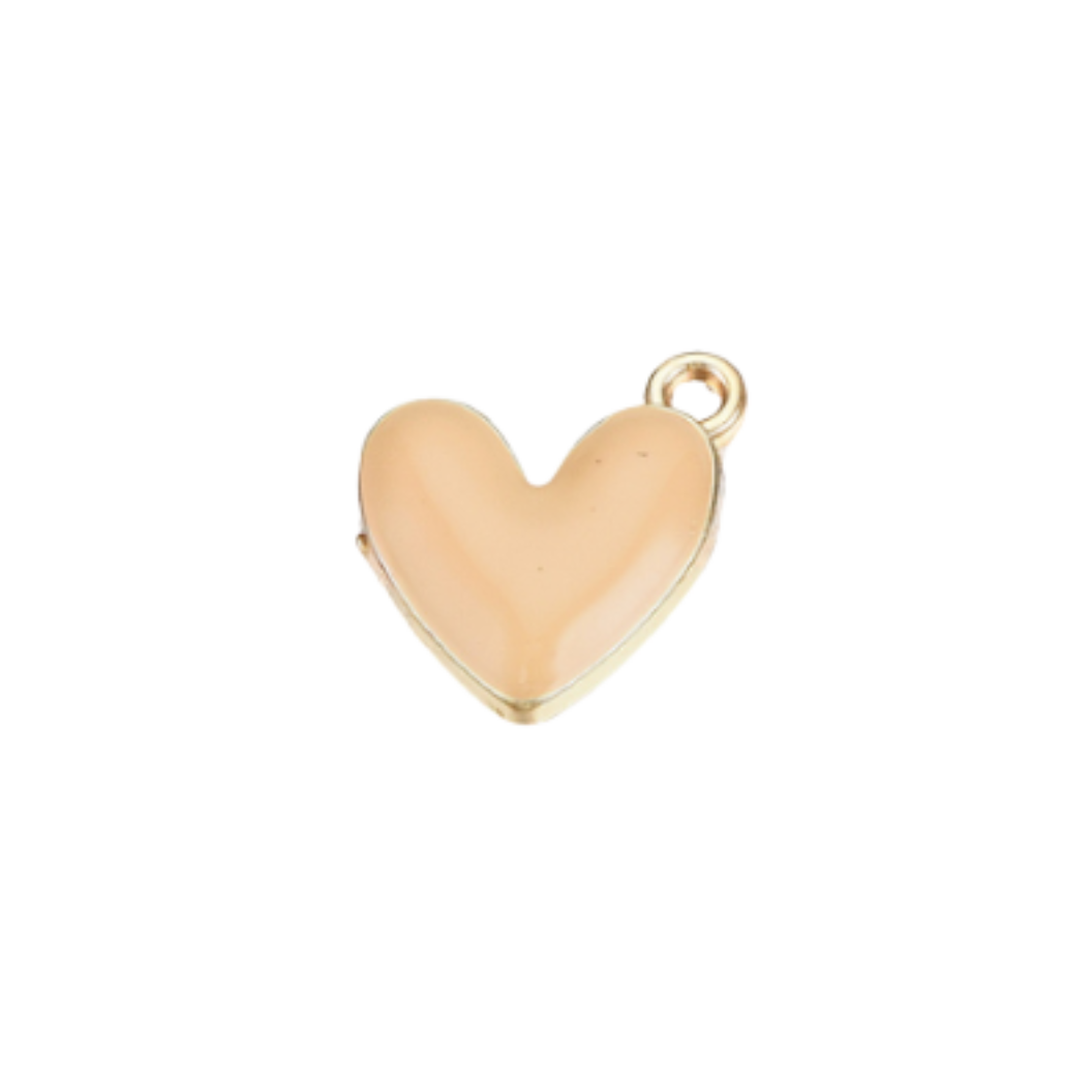 Gold heart-shaped charm on a clear background