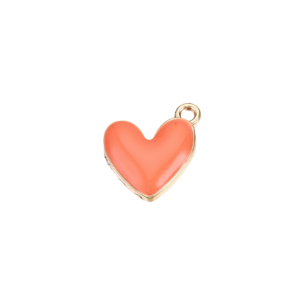 Heart-shaped charm with gold border and coral color on a white background