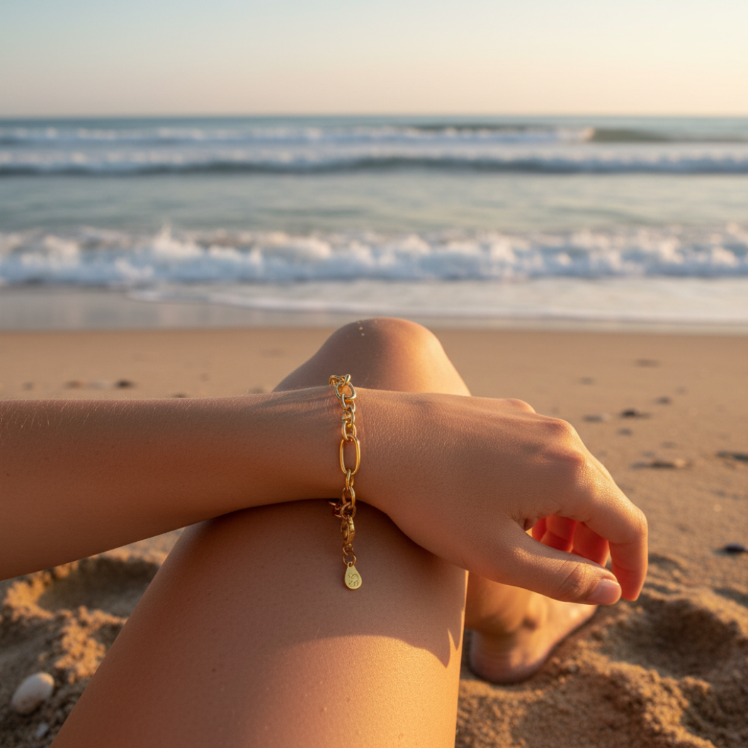 Gold Keepsake Bracelet on wrist at the beach 
