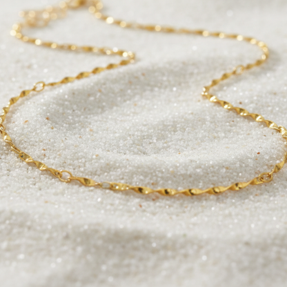 Gold Simple Twist Necklace | Waterproof, Hypoallergenic & Tarnish Resistant on sand as background 