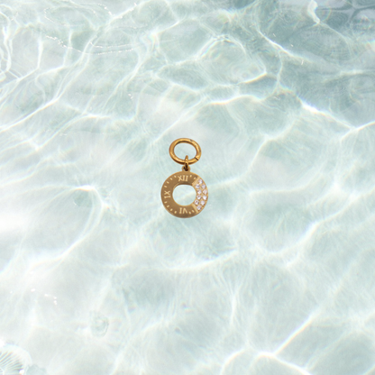 Gold Roman Radiance Ring with Cubic Zirconia Charm | Waterproof Stainless Steel on water background