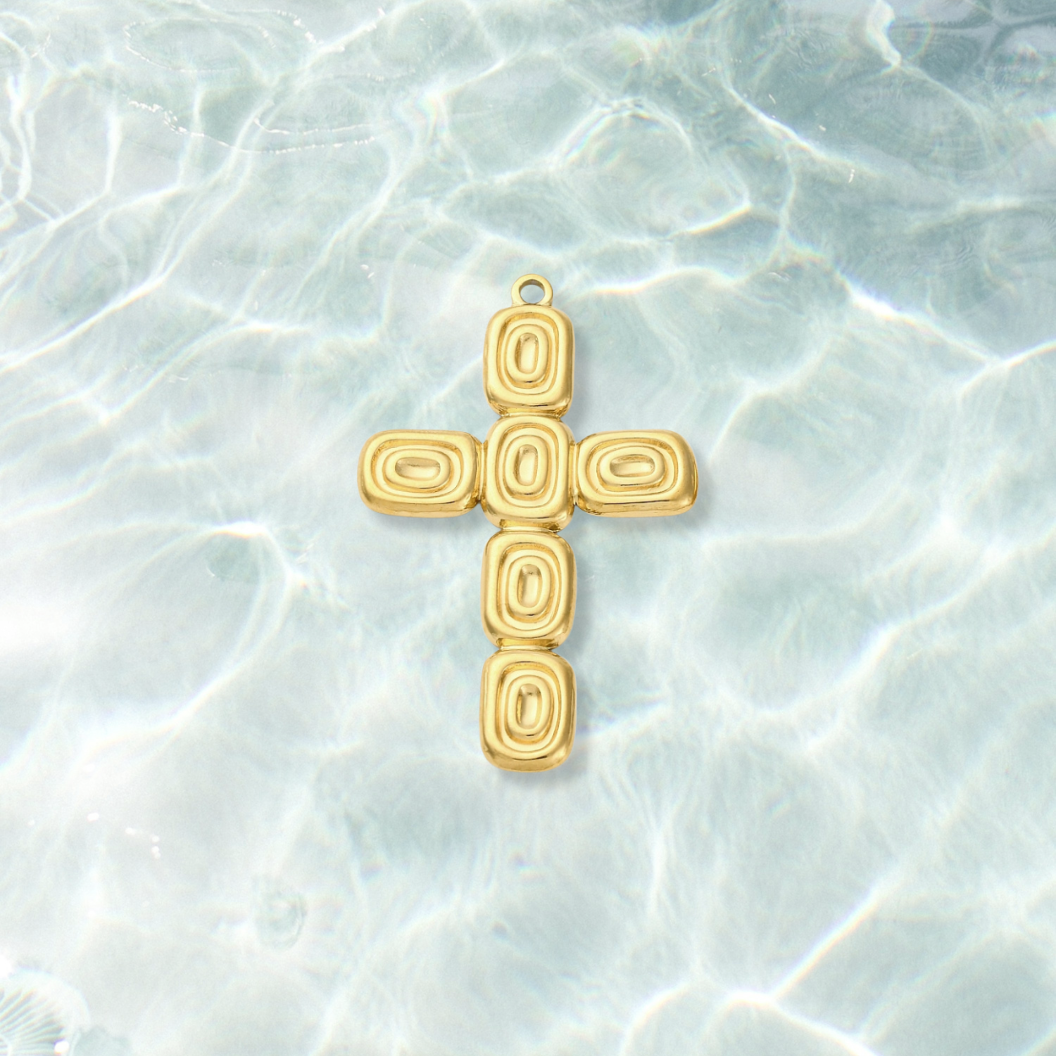 Gold Abstract Cross Charm  on water background 