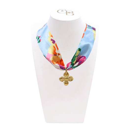 Front view of the Spring Floral Scarf Necklace with Gold Dogwood Charm on CB Bust