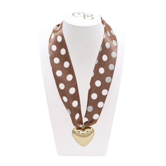 Front view of the Brown Polka Dot Scarf Necklace with Gold Embrace Heart Charm on CB Bust