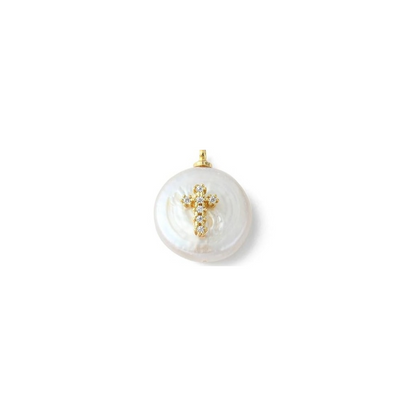A gold-colored freshwater pearl with a cross design on it, intended for use as a charm.
