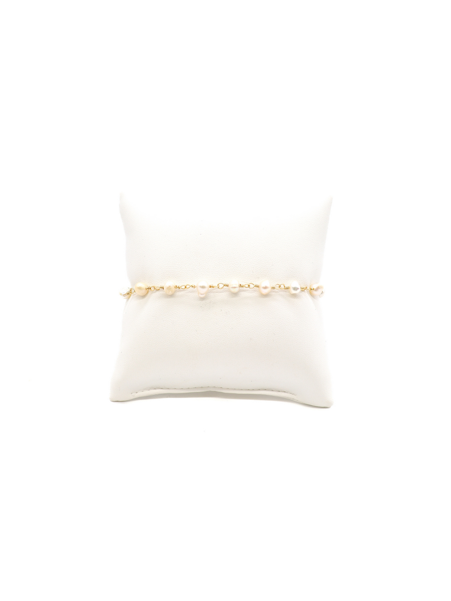 Beth Pearl Bracelet on white cusion.