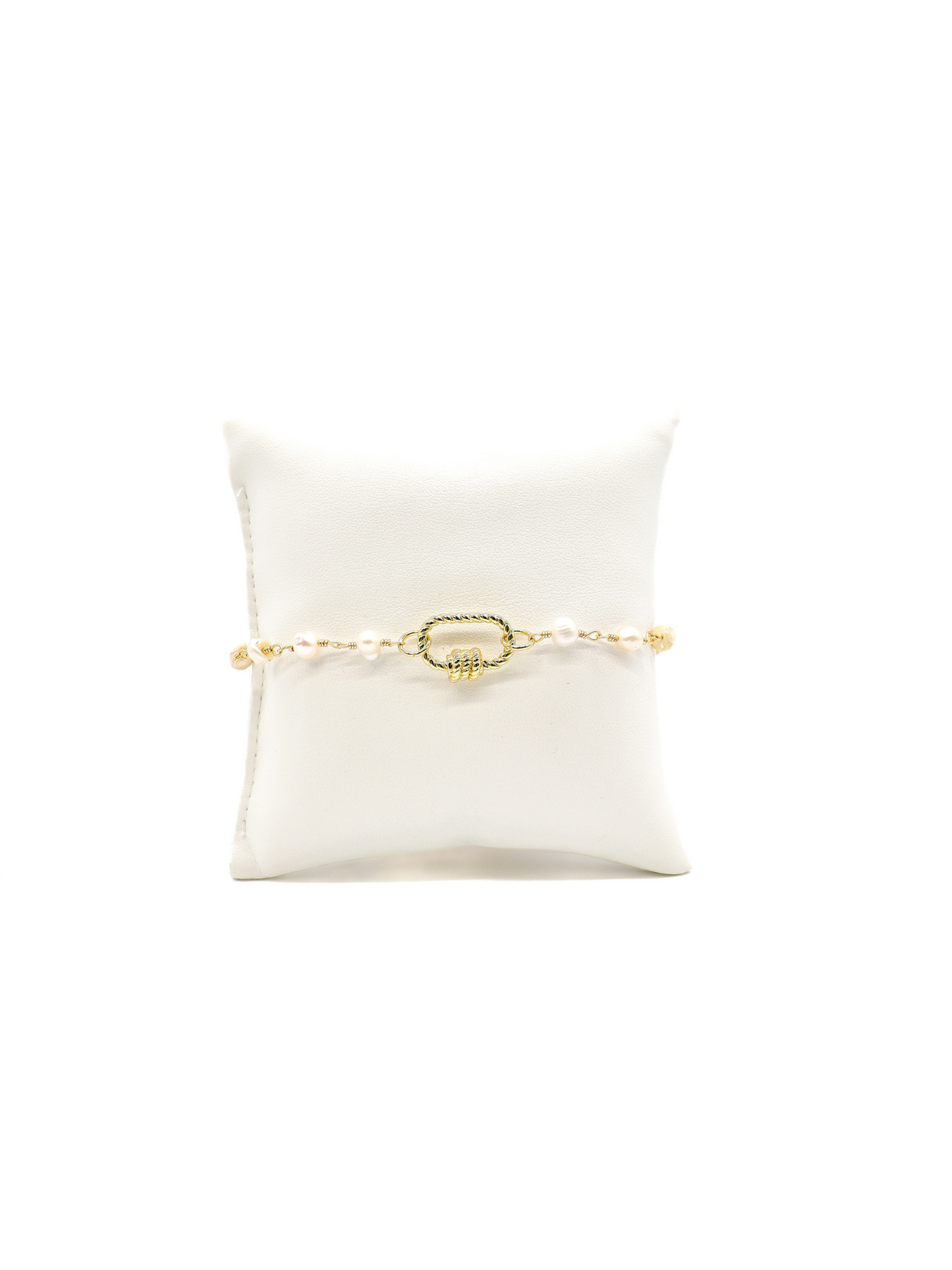 Beth pearl bracelet with Bella small oval twist carabiner on white cusion.