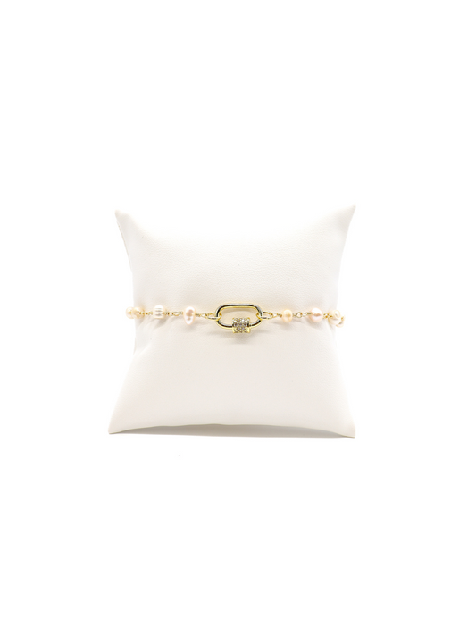 Beth pearl bracelet with Gabi white crystal carabiner on white cushion.