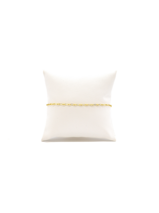 Madilyn chain link bracelet on white cushion.
