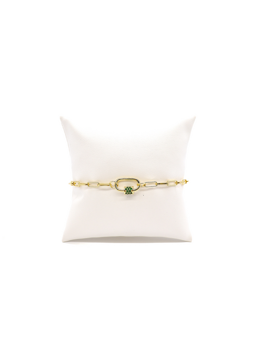 Ashley chain link bracelet with Gabi green crystal carabiner on white cushion.