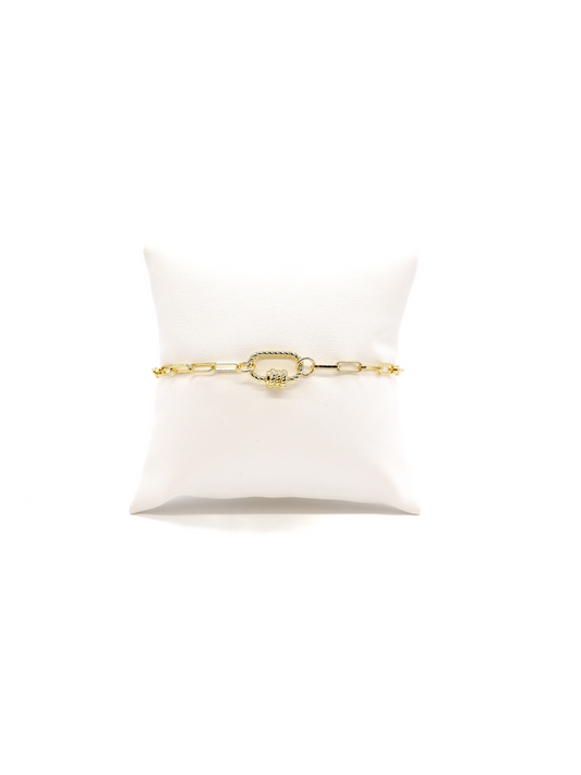 Ashley chain link bracelet with small Bella oval twist carabiner on white cushion.