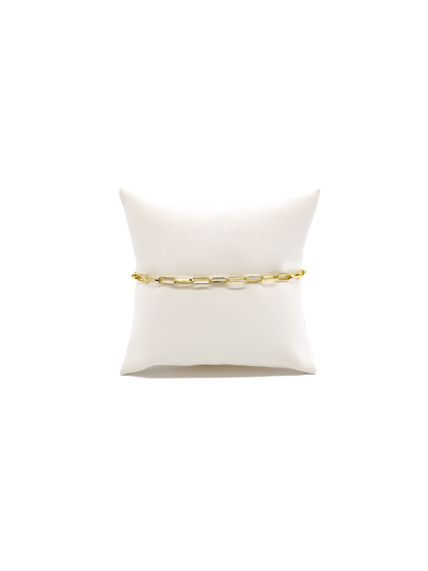 Ashley thick paperclip chain bracelet on white cushion.