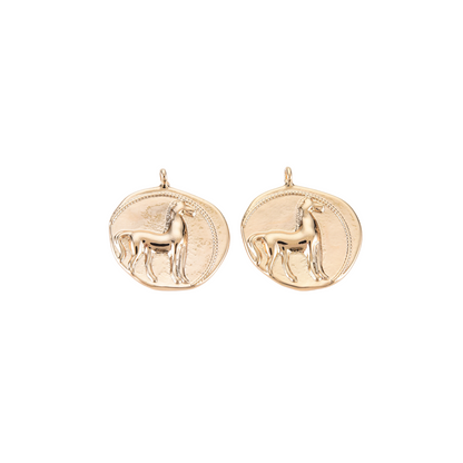 Two Spirit of the West Charms on white background, front view.
