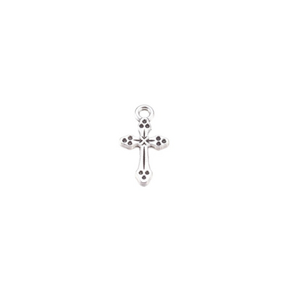 Etched silver antique cross charm on white background.