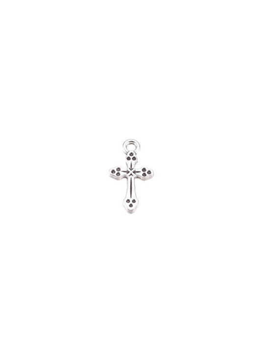 Etched silver antique cross charm on white background.