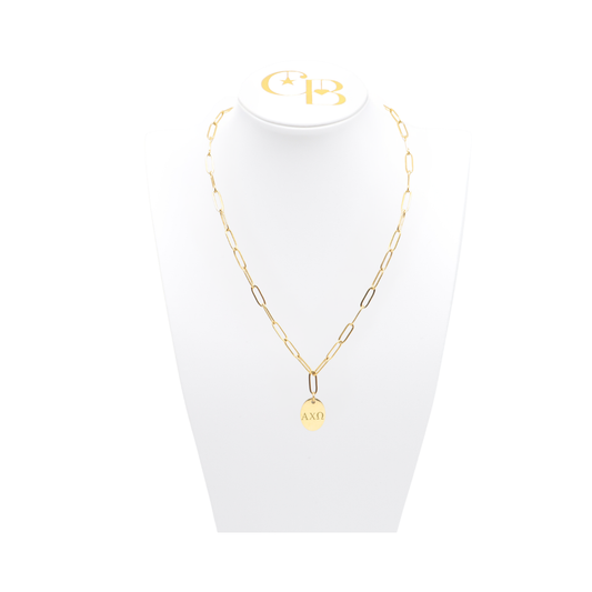 Alpha Chi Omega gold link storyline necklace with small oval charm with horizontal greek letters on white bust front view.