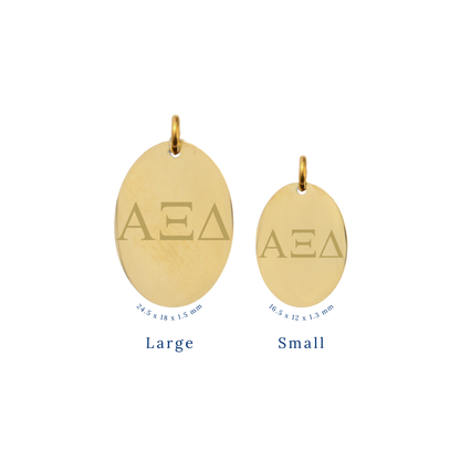 Alpha XI Delta gold large oval charm and small oval charm comparison with horizontal greek letters front view
