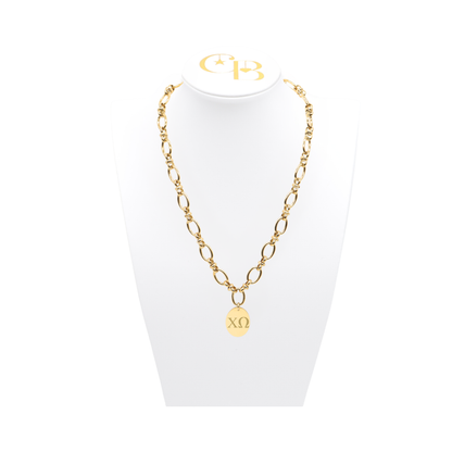 Chi Omega gold large link evermore necklace with large oval charm with horizontal greek letters on white necklace bust front