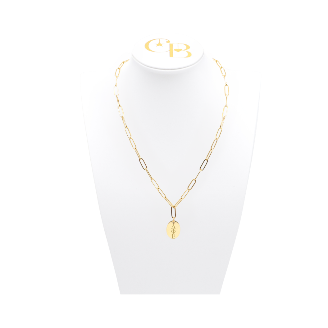 Delta Phi Epsilon gold link storyline necklace with small oval charm displayed on white necklace bust front view with vertical/stacked greek letters