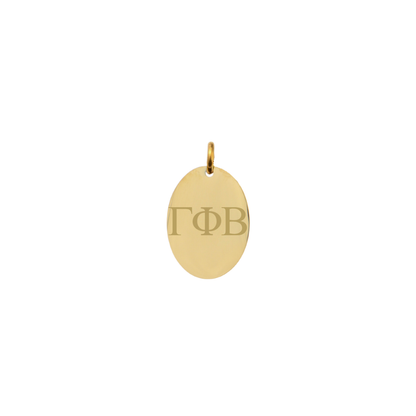 Gamma Phi Beta gold small oval charm with horizontal greek letters front view