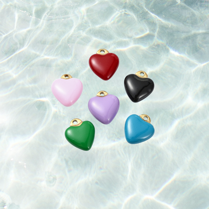 Gold colorful heart charm with assorted colors on waterproof background