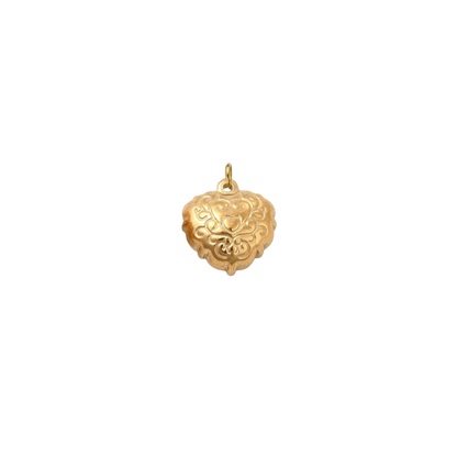 Gold filigree heart charm with an ornate engraved scrollwork design on a transparent background.