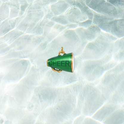 Gold green megaphone charm featuring the word "CHEER" in bold lettering on a shimmering water background.