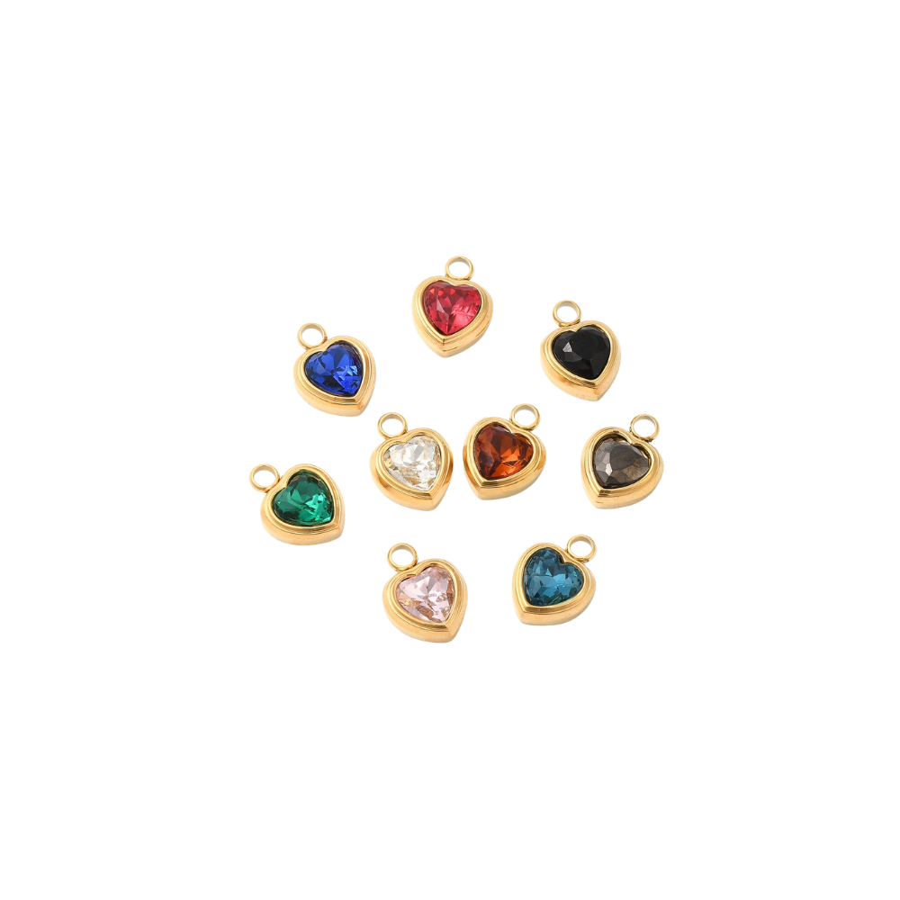 Gold heart assorted gemstone charm on a white background